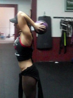 Medicine Ball Standing Triceps Extension Finish Position