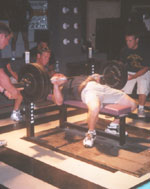 Kent Spires bench presses 530 lbs at a weight of 165.