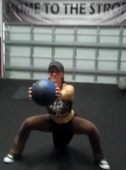 Medicine Ball Side Squat Punch Out Finish Position