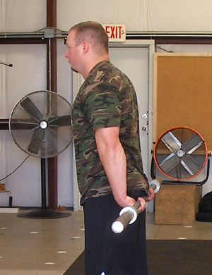 Behind the back barbell forearm curls