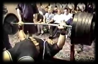 Ryan Kennelly performing an 800 lb bench press